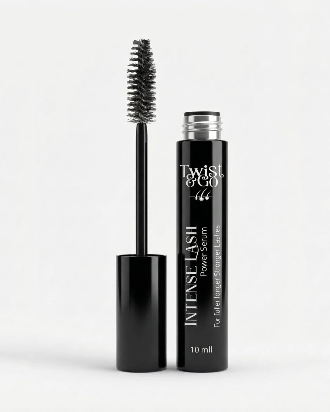 Black mascara with brush and bottle labeled 'Twist & Go' on a white background