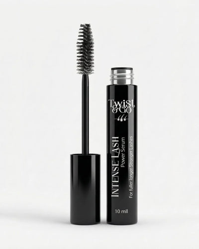 Black mascara with brush and bottle labeled 'Twist & Go' on a white background