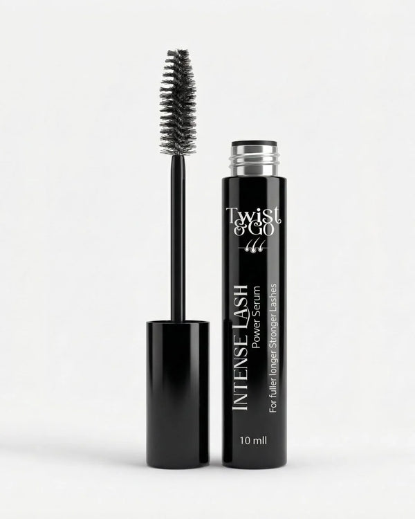 Black mascara with brush and bottle labeled 'Twist & Go' on a white background